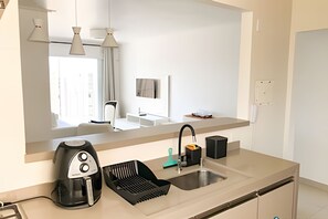 Fridge, microwave, oven, cookware/dishes/utensils