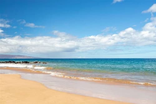 Beach nearby, white sand, beach umbrellas, beach towels