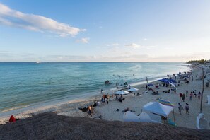 On the beach, sun loungers, beach towels