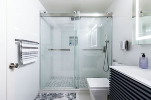 Shower, towels, soap, toilet paper