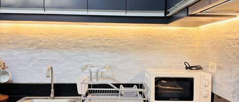 Microwave, stovetop, cookware/dishes/utensils