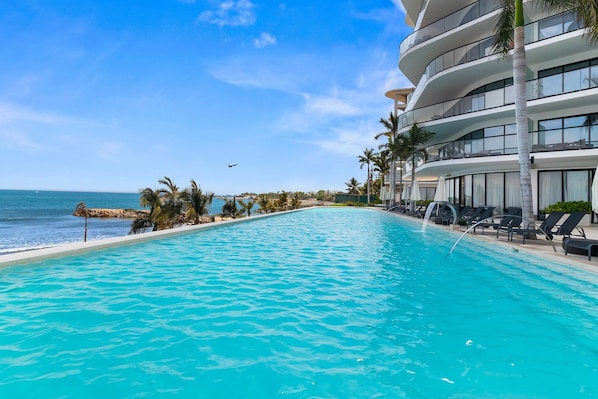 Deluxe Apartment | Pool | 2 outdoor pools, free cabanas, pool umbrellas