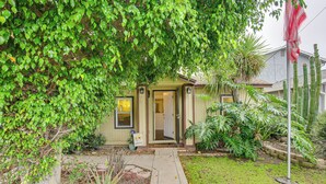 A house with a front yard, a door, and a flag. - 2 Mi to Ocean: Pet-Friendly Imperial Beach Retreat (Imperial Beach)