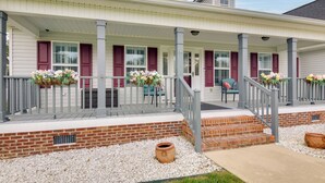 A two-story house with a covered porch, red shutters, and a brick foundation. - Near Rev & Civil War History Museums! Camden Home (Camden)