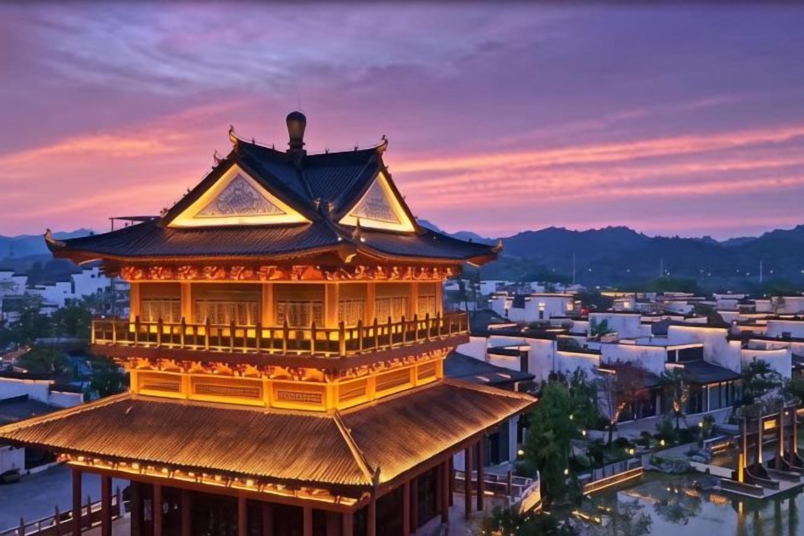 A traditional multi-tiered building with a prominent roof, surrounded by modern structures.
