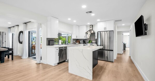Fridge, microwave, oven, stovetop - LUXE Lake Oasis I Dock, Pool & Designer Interiors (Boynton Beach)