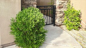 A residential building with a stone facade, a mailbox, and a number sign. - 100% of REVIEWS ARE 5 STARS!! GORGEOUS TOWNHOME with 5 TVs, popcorn machine, BBQ (Washington)