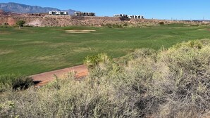 A golf course with a clear view of the green, a sand bunker, and a distant mountain range. - 100% of REVIEWS ARE 5 STARS!! GORGEOUS TOWNHOME with 5 TVs, popcorn machine, BBQ (Washington)
