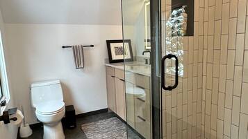 Shower, hair dryer, towels, soap