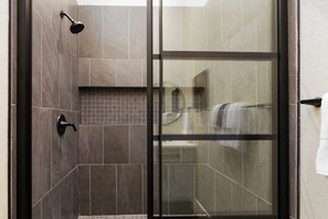 Shower, hair dryer, towels, toilet paper