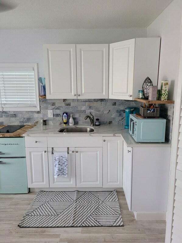 Fridge, microwave, coffee/tea maker, toaster