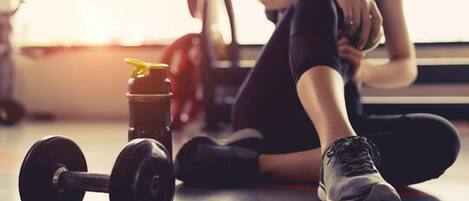 Energizing gym setup w/ free weights & space to fit in a quick workout