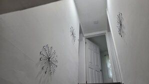 A staircase with a white door at the top.