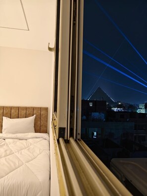 Chambre Triple Luxe, vue montagne | Terrasse/Patio