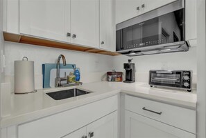 Fridge, microwave, coffee/tea maker, toaster