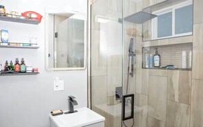 Shower, hair dryer, towels, soap