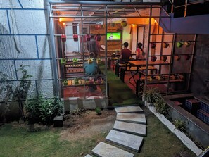 Outdoor dining - 7 separate bedroom and attached bathroom; Container wood house (Athigaretty,Ooty)