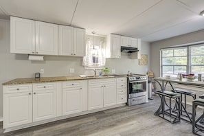 Fridge, microwave, stovetop, coffee/tea maker