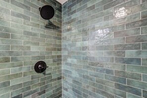 Shower, hair dryer, towels, shampoo