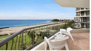A balcony with a view of the beach and ocean. - 26Dec 2026 to 2Jan 2027 Beach House Accommodation - New Years (Coolangatta)