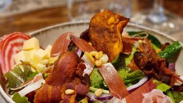 A bowl of salad with various ingredients.