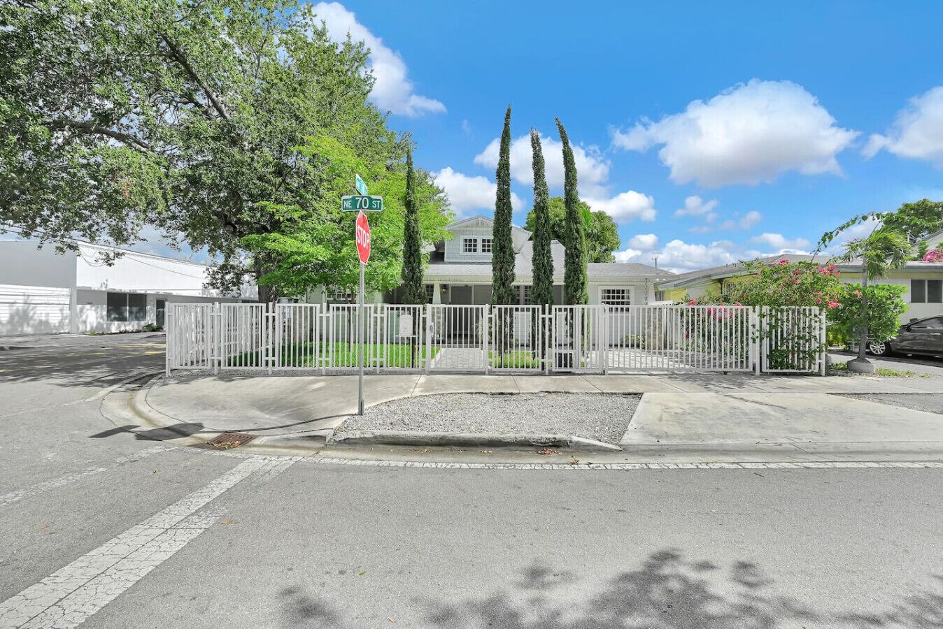 A gated residential area with a stop sign at NE 70 St.