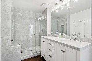 Shower, hair dryer, towels, shampoo