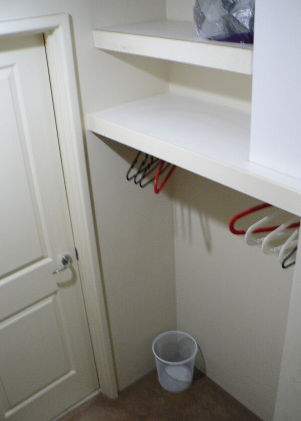 A small storage closet with a door, a shelf, and a trash bin. - Master retreat at Private Estate Near Perth CBD (Stirling)