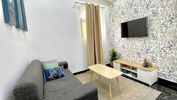 Appartamento Comfort, balcone, vista spiaggia | Area soggiorno