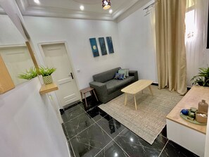 Comfort Apartment, Balcony, Beach View | Living area - Appartement Style Congo (Pointe-Noire)