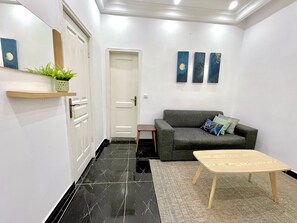 Comfort Apartment, Balcony, Beach View | Living area