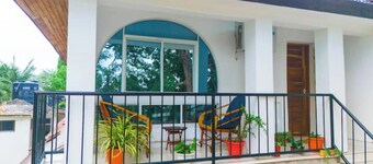 Minzi Homes | Cozy Green Escape with balcony views