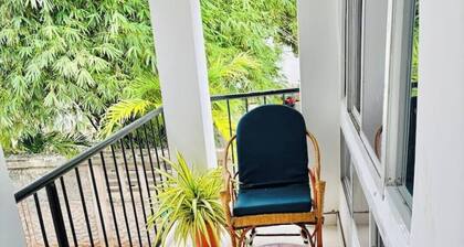 Minzi Homes | Cozy Green Escape with balcony views