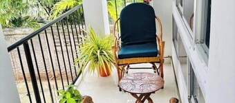 Minzi Homes | Cozy Green Escape with balcony views