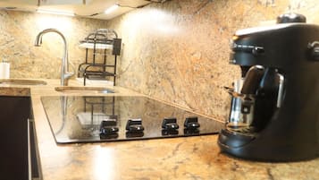 Microwave, stovetop, coffee/tea maker, cookware/dishes/utensils