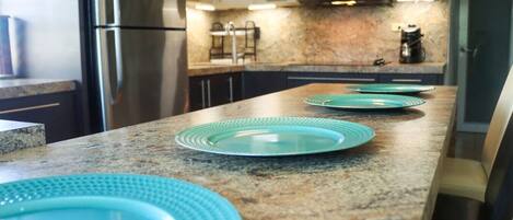 Microwave, stovetop, coffee/tea maker, cookware/dishes/utensils