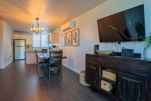 Microwave, stovetop, cookware/dishes/utensils, dining tables