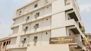 A multi-story building with a sign for Hotel Magadh Regency. - HOTEL MAGADH REGENCY (Patna)