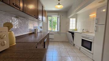 Apartment | Private kitchen | High chair, cleaning supplies