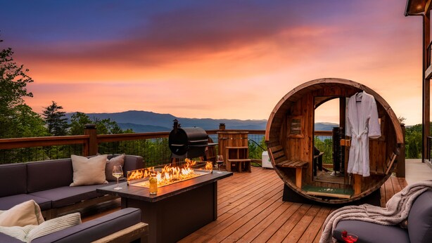 A wooden deck with a barbecue, outdoor seating, and a wooden barrel structure. - Cozy Luxe Home,Breathtaking Mtn. Views of fall foliage, Outdoor sauna,large deck (Sevierville)