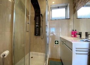 Shower, hair dryer, towels, soap