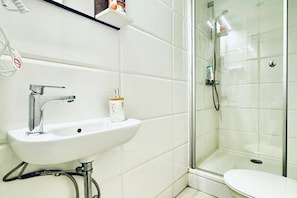 Shower, hair dryer, towels, soap