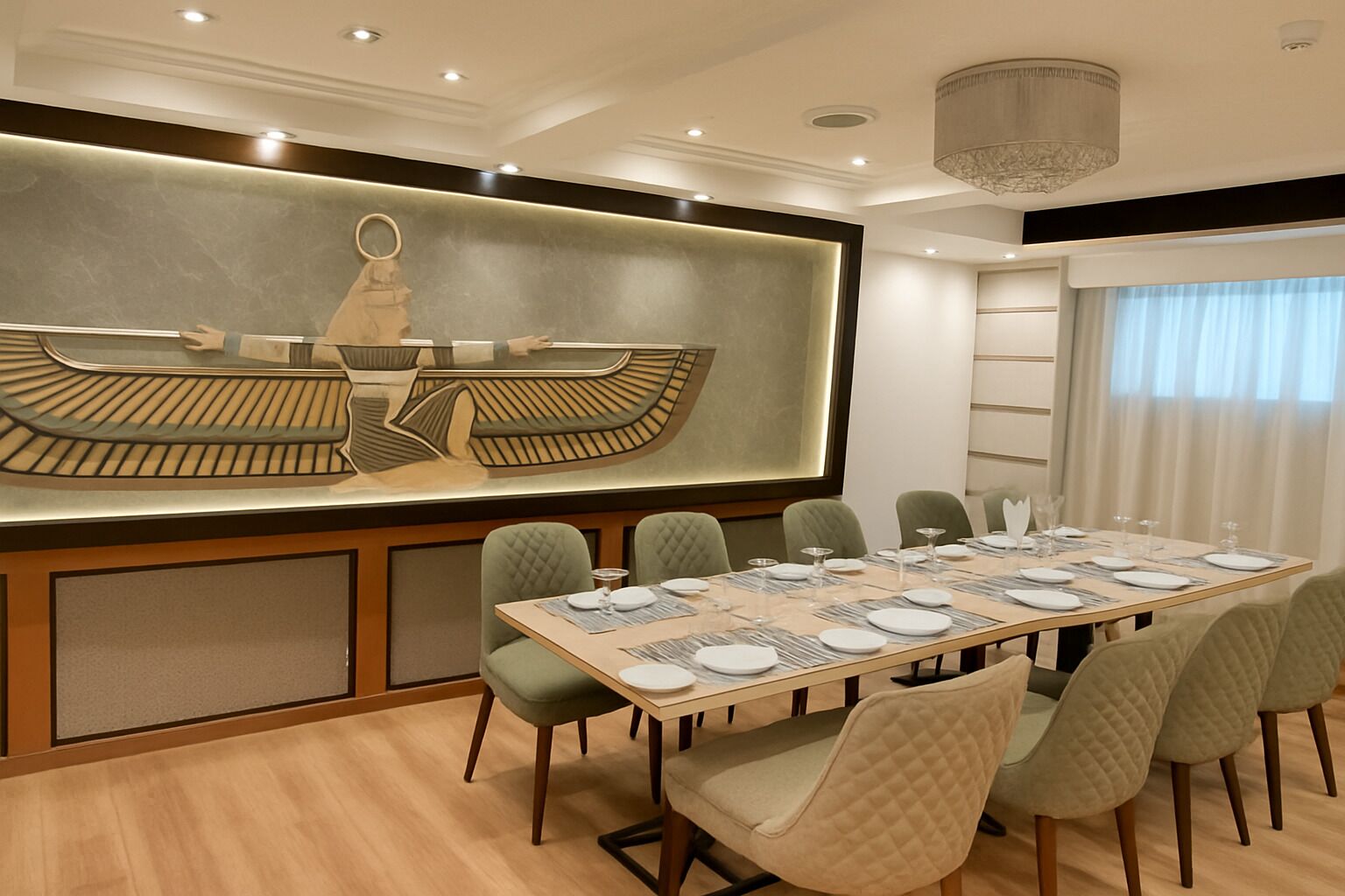A conference room with a long table set for a meeting, surrounded by chairs.