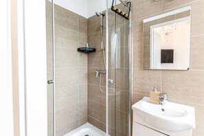 Shower, hair dryer, towels, soap