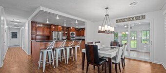 Quiet Riverfront 3BR/2BA house with Spa, Dock, and Golf Carts