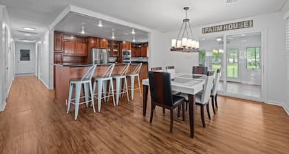 Quiet Riverfront 3BR/2BA house with Spa, Dock, and Golf Carts