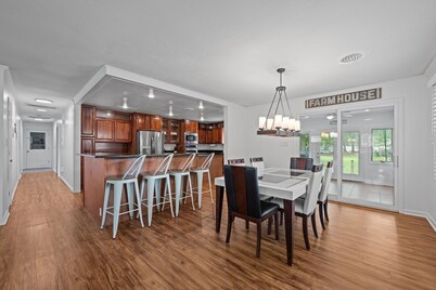 Quiet Riverfront 3BR/2BA house with Spa, Dock, and Golf Carts