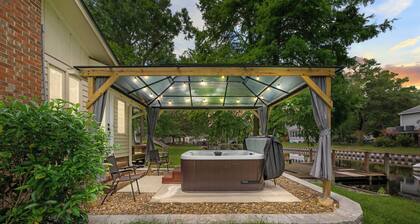 Quiet Riverfront 3BR/2BA house with Spa, Dock, and Golf Carts