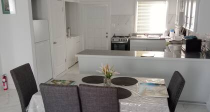 Charming unit 2 ----- 2 bedroom apartment in cool Rock Sound with AC