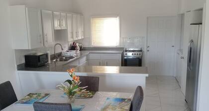 Charming unit 2 ----- 2 bedroom apartment in cool Rock Sound with AC